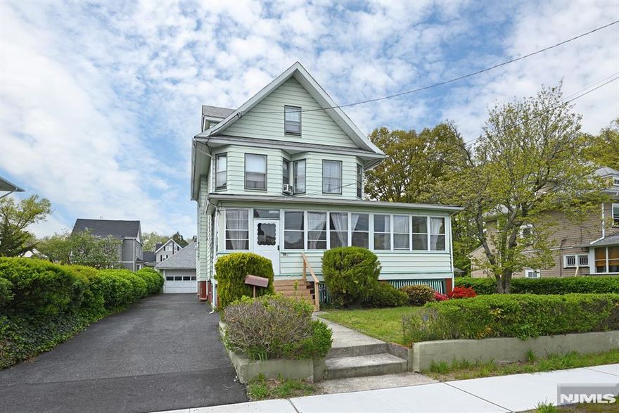 Turn-of-the-century Colonial-style home, situated on an oversized lot. Offering 5 bedrooms and 3 full baths. Features natural woodwork and hardwood floors throughout. Spacious layout with bright, generous-sized rooms. A finished bedroom in the attic and an additional unfinished space for a possible primary suite. A wide front porch enhances curb appeal and provides a welcoming entry. Park-like yard offers ample outdoor space for recreation and entertaining. Located on a tree-lined street near parks, schools, and bus to New York. Detached 2-car garage with additional parking for up to 4 cars. Strong potential for customization and value-add opportunities.