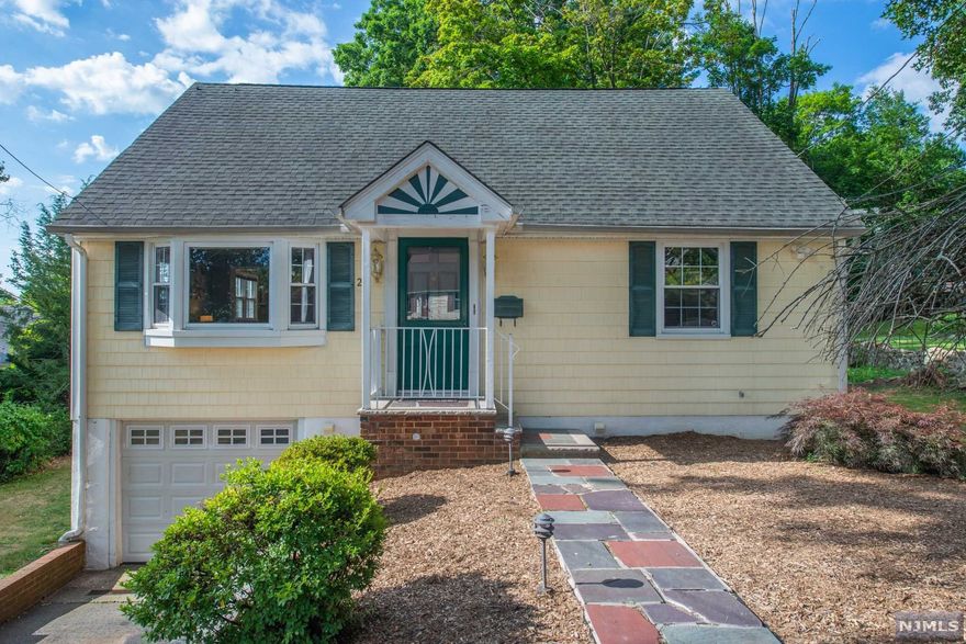 Charming Cape Cod featuring many updates in the last 7 yrs. Purchase just in time to enjoy summer bbq's on deck & the expansive yard for entertaining. Keep cool in your home with central air while enjoying the 1st fl flow from living room to the formal dining room which leads to the deck through sliders & opens to the updated kitchen. Two bedrooms & an updated bath with jacuzzi tub are on the 1st fl. The second floor features 2 bedrooms & a central updated full bathroom. The basement was recently updated with luxury vinyl plank floors and makes a great recreation room space. The outside features a motorized awning and a storage shed with loft and work bench. There's easy access to NYC bus, NJ Transit bus, restaurants, shopping, Route 280, and the FREE West Orange Jitney to South Orange and Orange NJ Transit train stations (Routes 4 and 5).