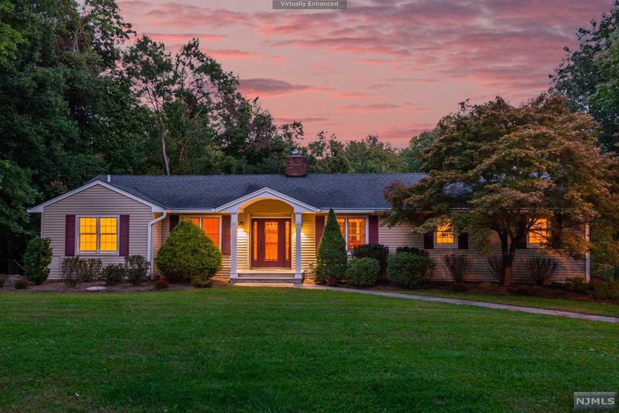 Here, true one-floor living is not just possible, it's perfected. The main living areas, all 4BR's and laundry are on one floor! You will appreciate the thoughtful additions/expansions that make this home so special, like the kitchen with vaulted ceiling, wall of windows w/centerpiece gas fireplace, large center island that seats 8, plus abundant cherry cabinets, granite counters and door to the deck. Likewise, the expanded, private MBR suite (in a separate wing) features a vaulted ceiling, huge WIC, and bath w/jetted tub and stall shower. The LR has a wood burning fireplace and there is a home office w/French doors for privacy. On the opposite side of the house from the MBR suite are 3BR's and full bath w/SOT. The lower level features access to the 2-car garage, storage, large closet, half bath and *TWO* large, finished bonus rooms: one w/a wood burning fireplace, built-in bar, and sliders to the patio/yard w/several seating areas and fire pit. WOW! An entertainer's delight!