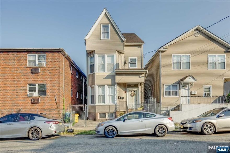 Don't miss this excellent opportunity to either live in and collect rent or invest in a solid legal three-family home. Each unit boasts three bedrooms, separate utilities, and there's a fenced-in yard. Tenants are currently on month to month lease. Basement is roughed out for bathroom and framed. Conveniently located near shopping, transportation, and a hospital, this property is great for both homeowners and investors alike.