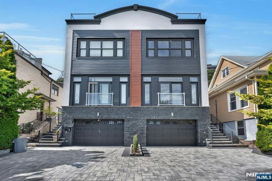 Discover urban sophistication in this stunning Edgewater townhouse, a modern gem just minutes from New York City! This meticulously designed 3-bedroom, 3.5-bathroom triplex offers an exceptional living experience with George Bridge, Hudson River views from primary bedroom and unparalleled convenience. Nestled on a charming tree-lined street, this 2010-built residence seamlessly blends luxury and functionality. The main level welcomes you with elegant, marbled flooring and an open, airy living and dining room anchored by a granite-trimmed gas fireplace. The gourmet eat-in kitchen is a culinary enthusiast's dream, featuring stainless steel appliances and granite countertops. The picturesque sliding glass doors lead you to a private, fenced rear yard. Brazilian cherry wood floors flow throughout, complemented by a striking wrought iron staircase that adds architectural drama. Each of the three bedrooms provides a sanctuary of comfort, with spa-like bathrooms and custom closets ensuring both style and practicality. The finished lower-level family room offers additional flexible living space, while the landscaped private rear yard provides a tranquil outdoor retreat. Convenience is key: walking distance to NYC transit, bus, and ferry, with easy access to parks, schools, and major commuter routes like the George Washington Bridge and Lincoln Tunnel. Tenantâ€™s responsibilities include all utilities, rentersâ€™ insurance, landscaping, snow removal and additional fees will apply.