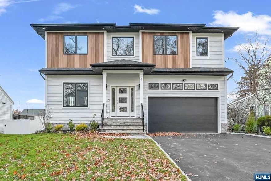 This 6BD 5.5BA Custom Colonial home built by RODAK HOMES w 4600+/- sf of finished living space over 3 floors features a 2 story foyer, gorgeous hardwood wide plank flooring throughout with extensive trim, custom millwork & finished closets. Home includes a formal Living Room/Dining Room, expansive Kitchen, Family Room w electric fireplace & sliders to paver patio. The Kitchen is complete with high-end SS appliances including 48" sub zero fridge and 36" wolf range, large center island with 1 sided waterfall, quartz counters & ceiling height cabinetry. The 1st floor en-suite for guests/office, powder room & mudroom complete the first floor. The 2nd floor is home to 4 Bedrooms including an en-suite, 3 Bathrooms & Laundry. Primary Suite is complete with large custom walk-in closet, spa-like bath with a soaking tub, stall shower & dual sinks. Full finished, walk-out basement with Bedroom, large Rec Room with built-in bar & full Bath. 10 YEAR BUILDER WARRANTY .