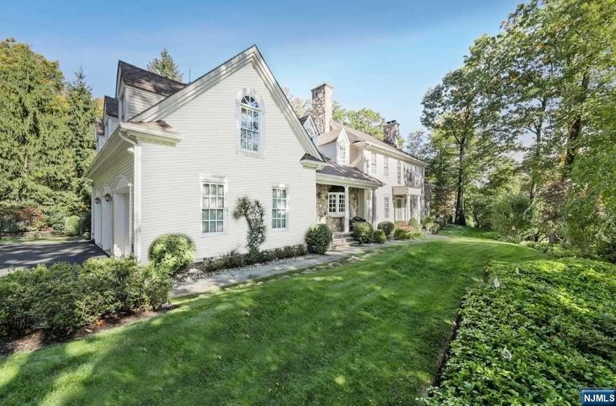 Spectacular fully renovated custom colonial with approximately 6670 sq ft of living space including finished lower level. Heart of Short Hills location on gorgeous property close to NYC trains and stellar schools. Exquisite designer finishes featuring an open floor plan, high ceilings, on-trend renovations + multiple indoor and outdoor entertaining spaces. Foyer with sweeping curved staircase leads to Formal Living Room opening to Family Room, Sunroom/Game Room + Library. Chef's Kitchen with custom cabinetry, center island, granite counters, high-end stainless steel appliances leads to double-height Breakfast Room, covered porch and attached 3-car garage with electric charger. Back stairs provide addl access to 2nd level sitting room; Primary Bedroom Suite with fireplace, 3 walk-in closets, sitting area + luxe Bathroom; Bedroom 2 is ensuite; Bedroom 4 and 5 provide adjoining full bath; 5th Bedroom and Laundry Room. Lower Level Rec Room, Wine Room, Exercise Room + Studio/Office.
