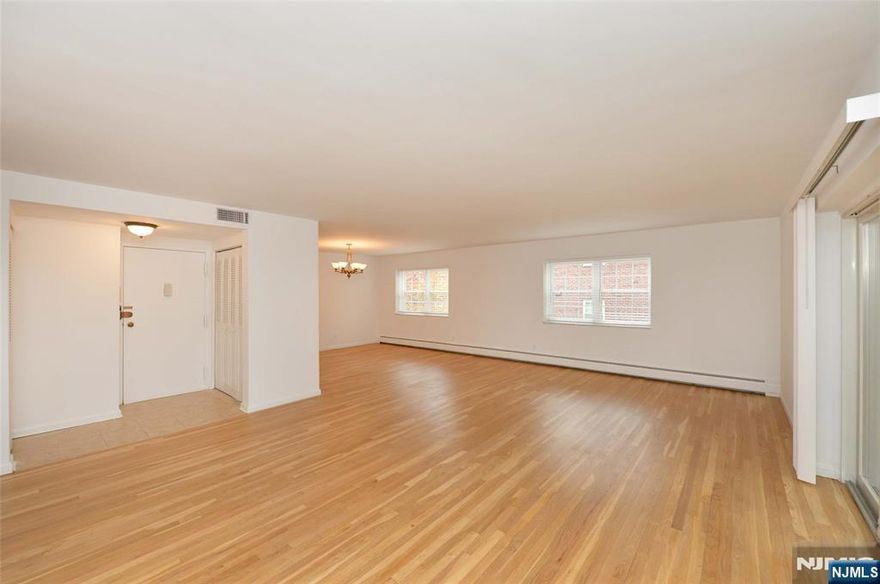 Beautifully Renovated 2-Bedroom, 2-Bath Apartment in a Prime Location! This spacious second-floor unit in a meticulously maintained and quiet complex has been completely renovated from top to bottom. Step inside to discover a bright and open layout featuring recessed lighting, gleaming hardwood floors, and abundant storage throughout. The large dining area flows seamlessly into the inviting living room, perfect for both everyday comfort and entertaining. The modern, fully renovated kitchen is equipped with brand-new stainless-steel appliances and generous cabinet space. The home offers two spacious bedrooms, including a primary suite with a private en suite bath, as well as an additional full bathroom and a dedicated office space. Enjoy year-round comfort with central air conditioning and baseboard heating. One parking space is included on a first-come, first-served basis, with optional garage parking available for an additional fee. Laundry facilities and extra storage units are conveniently located on-site (available at cost). Ideally situated just steps from public transportation, major highways, top-rated schools, shopping, and dining. No pets permitted. Renters insurance required.