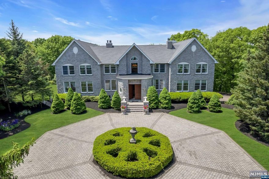 Experience the ultimate luxury in this stunning custom home, inspired by the grandeur of a chateau. nestled on a private mountain, this exquisite property spans 10.36 acres and is accessed via a private road leading to a circular driveway and a 3-car garage. Enter through the grand 2-story foyer, and be greeted by a magnificent stained glass Fresca, setting the tone for the elegance that flows throughout the home. The grand 2-story living room features a stunning woodwork fireplace and is bathed in natural light. The gourmet kitchen is equipped with custom wood cabinetry, WOLF appliances, a breakfast bar, making it a chef's dream. The master bedroom is a luxurious retreat, spread across three levels, with a cozy fireplace, walk-in closets, and a grand en suite with a soaking tub overlooking the serene backyard. A convenient first-level guest ensuite ensures comfort for your guests. The 2nd floor offers 3 bedrooms, 3 baths, an office, and a study room.