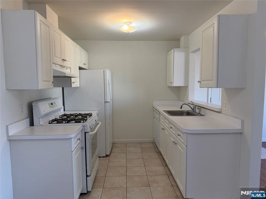 1st month free and 1 parking space included for occupancy by May 1st! Large 2 bedroom 2 full bath unit with hardwood floors throughout, high ceilings, central air conditioning and intercom system. Spacious layout. Light and bright. Laundry room on first floor of building. One assigned parking space included in the rent. Small pets allowed (25 LB limit) Tenant responsible for all utilities. Desirable location in Palisades Park! Available immediately!