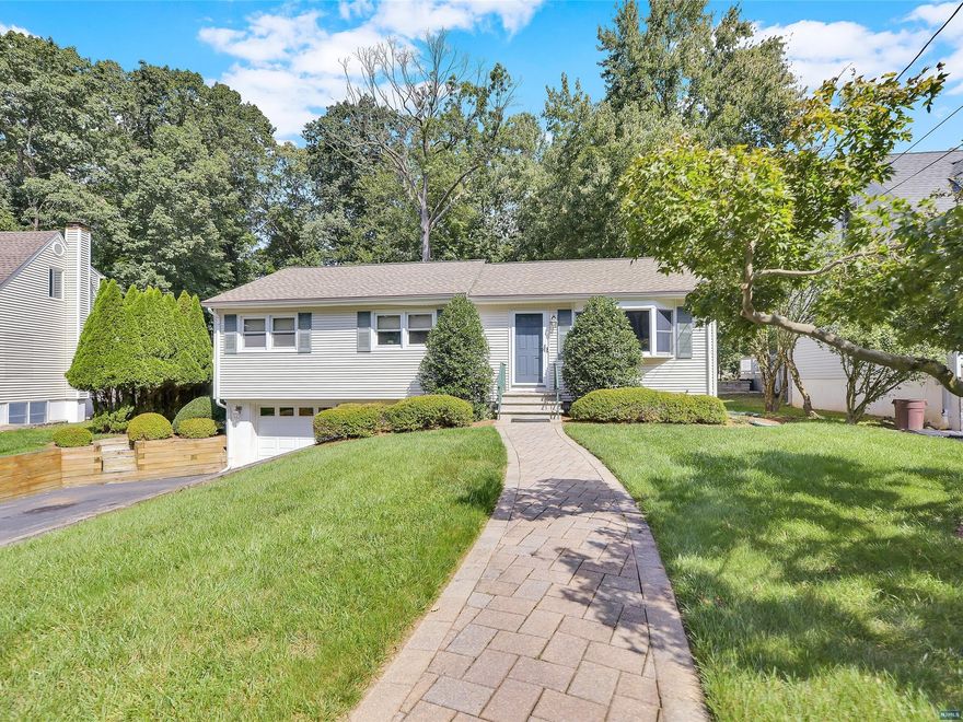 Welcome Home. Enjoy the ease of one floor living in this lovely Ranch style home in good condition. Situated on a quiet side street on a deep property this home is sure to please. Imagine dining al fresco on the private back deck or playing your favorite yard games on the green grass of your own backyard. Special features of this updated home include a Modern eat in kitchen with maple cabinets and Corian Countertops, granite countertops (hall bathroom), custom crown molding, newly refinished hardwood floors and freshly painted walls, fully finished basement w/ double sink wet bar, large storage shed, and much more. Best of all it can be yours!