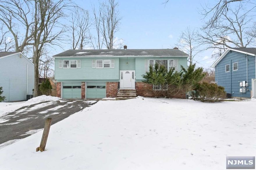 This solid, well-maintained home has it all: 4 large BRs w/plenty of closets, 2 1/2 BAs, FR w/fireplace. Modernized sun-filled kitchen has access to large deck, new oven, refrigerator w/cabinet panels, eat-in peninsula & wall open to DR. LR is spacious & bright. DR has spectacular floor to ceiling built-in for all of your treasures & still room for a large table. Primary BR has WIC & full BA w/shower. This can be your DREAM home in the welcoming activity-filled Ramsey Golf & Country Club. Desired lifestyle w/upcoming new pool, new beach, new clubhouse, golf, platform tennis, pickleball, fishing, kayaking, sledding, socials & charity events - membership a must! A fresh coat of paint & polishing of the recently uncovered hardwood floors is all this comfortable home needs! Ramsey is known for their award-winning schools, award winning pool complex, adorable downtown, restaurants, shopping, 2 train stations, bus & walking paths. Priced to sell.