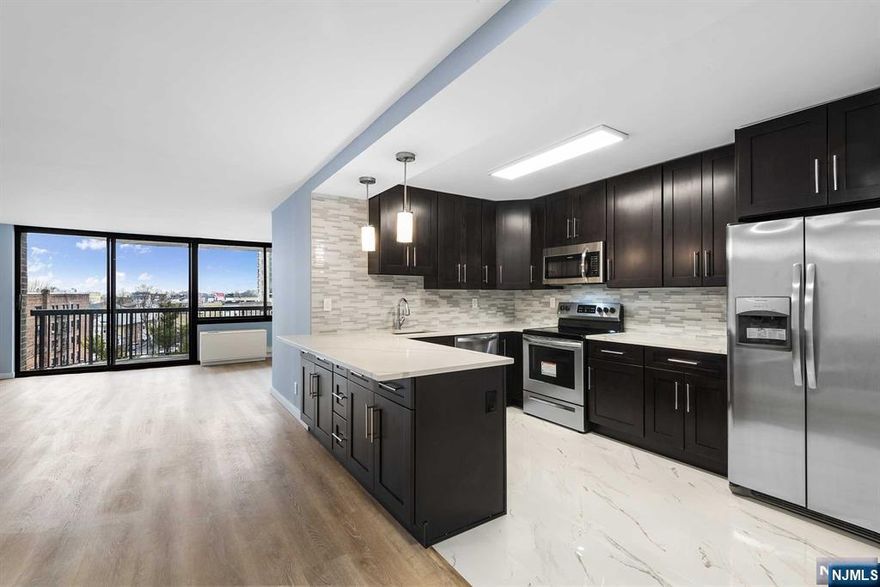 Looking for a fully renovated unit in a full-service building with transportation right at your doorstep? Look no further. Experience this bright, updated apartment with stunning NYC views. The spacious layout features an open kitchen with a dining nook, a large living room leading to a private terrace, and a convenient half bath for guests. The separate master suite boasts a huge walk-in closet and a luxurious marble bathroom. This unit also includes a storage space, parking spot, and all utilities are covered with the rent! Greenhouse is a full-service condominium offering 24-hour security, a gym, outdoor pool, sauna, and community room. Plus, it's an easy commute to NYC!