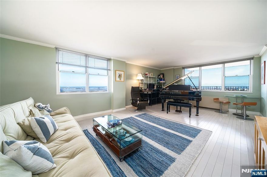 Experience luxury living with breathtaking sunset views from every window of this sophisticated SW corner residence. This impeccably renovated home features a flex/dining room that can convert into a second bedroom. Enjoy beautiful flooring, a spacious living area with river and downtown views, and a kitchen with high-end appliances, including a Liebherr refrigerator and Bosch dishwasher. The spa-like bathroom, ample closet space outfitted with custom California Closet build, and a private 200 SqFt terrace complete this home. Located in the prestigious Riviera Towers on Boulevard East, this luxury community offers 24-hour concierge services, valet parking, a pool, gym, and on-site conveniences like parking, an ATM, convenience store, and dry cleaning. The all-inclusive maintenance fee covers real estate taxes and utilities for a worry-free lifestyle. Steps from shopping, supermarkets, coffee shops and fine dining, with easy access to NYC via public transportation at your door.