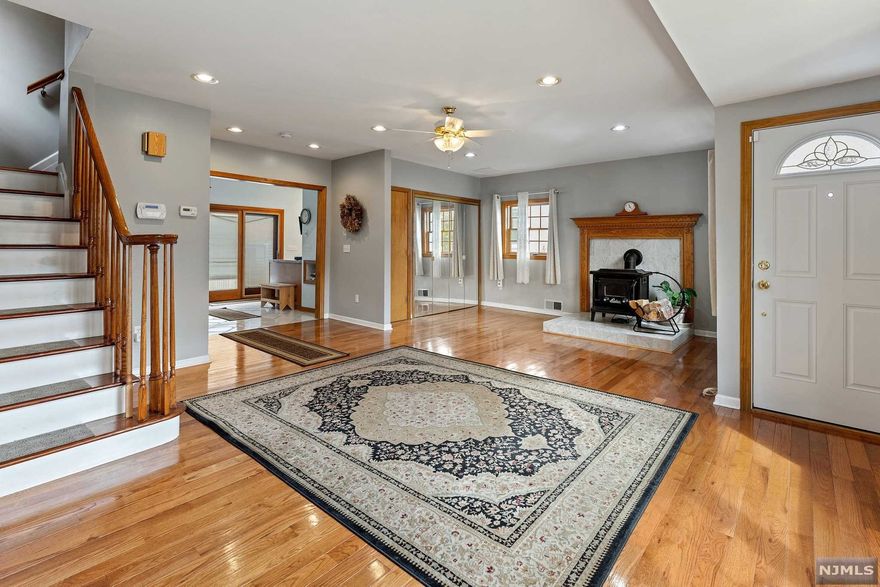 Incredible opportunity to own this exquisite 3 bed, 2 bath home. Stunning wood floors, open floor plan, beautiful deck overlooking large yard that backs up to woods for privacy. Large garage PLUS oversized shed for plenty of storage/workspace. Includes security system with cameras, radiant heated bathroom floor, Generac whole house generator. This one won't last!!