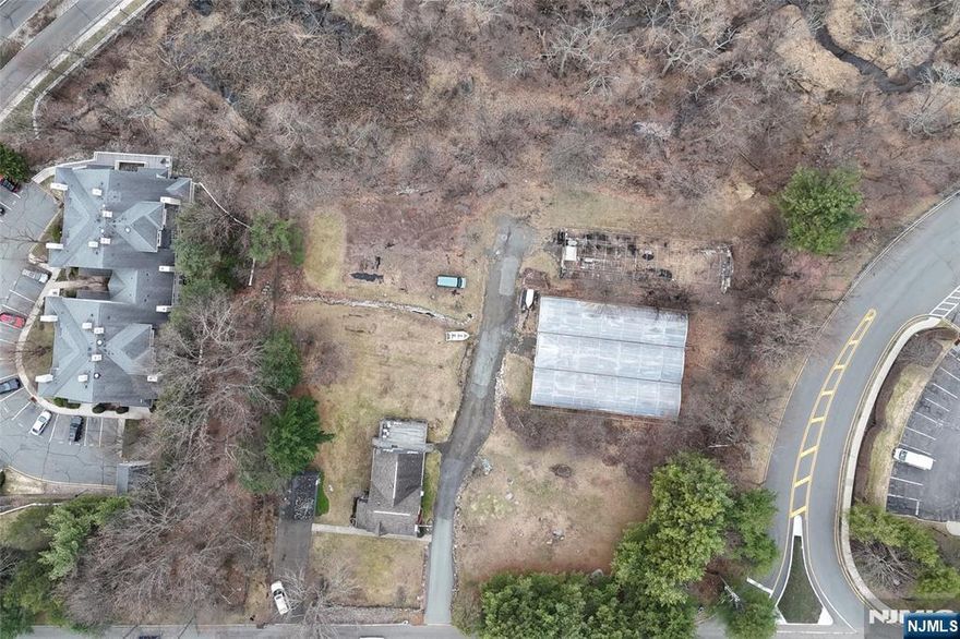 There is a livable home, garage and green houses on the property The estate has EXPIRED subdivision plans for lots THE LOT IS ZONED PRD4
