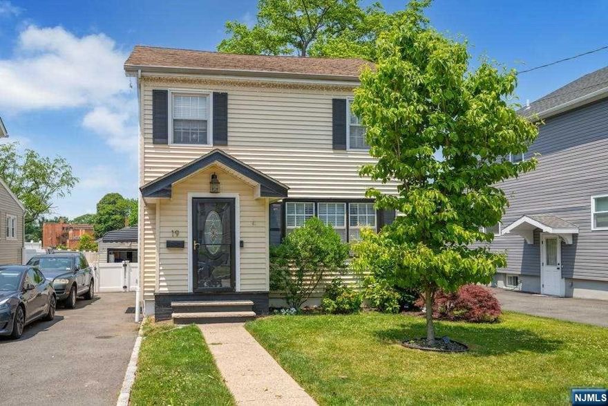 Located in the desirable Oak View section, this side hall colonial is nestled on a quiet, dead end street. The 1st floor boasts a small vestibule/entryway leading to a spacious living room. A large dining room with a stained glass window is a great space for gatherings. The kitchen completes the first floor and allows access to a rear deck or a full bath. Heading up to the 2nd floor, you will find 3 bedrooms, a full bath w/linen closet inside, and a large linen closet just outside the bath in the hallway. There are pull down attic stairs for extra storage. Both the 1st & 2nd floors have HW flooring. The basement is partially finished, with 1/2 bath and utility/laundry/storage area, and is a perfect rec space for a home gym/play area. The rear yard offers a deck with steps leading down to a lower patio, vinyl fence, & a saltwater, above ground pool. Located three tenths (.3) of a mile to NYC bus transportation, and close to Bloomfield North Center, shopping & houses of worship.
