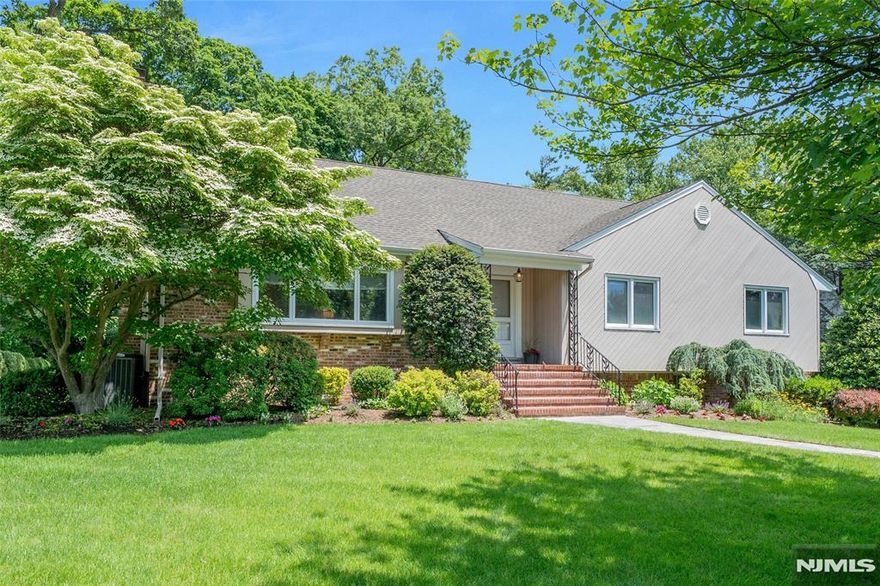 This beautiful 5-bedroom, 4 full bath home with pool, outdoor kitchen and flexible living space is located in the coveted Gold Coast section of Glen Rock. You'll discover that this spacious and light filled expanded ranch offers room to grow, relax and entertain- inside and out. Featuring a flexible floor plan with a large eat-in kitchen, formal dining room, den, and a bright living room with a wood-burning fireplace, the main level also includes a laundry area, full bath, 3 large bedrooms, (one en-suite) making it ideal for convenient one floor living. Upstairs, enjoy a generous primary suite with over-sized closets and a large bonus room-- perfect fifth bedroom, home gym, or private retreat. The finished lower level provides even more space for guests, recreation or extended family. The private level backyard is a summer dream w/ heated in-ground pool, patio and full outdoor kitchen. Modern upgrades include a whole house generator, EV charger and oversized two car garage. This is a rare opportunity to enjoy comfort, space and lifestyle all in one!