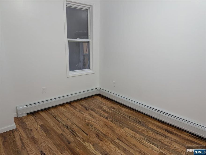 Big 2 bedroom 1 bath on a second floor. Wood Floors. Spacious Kitchen. Utilities separate. Close to bus and trains.