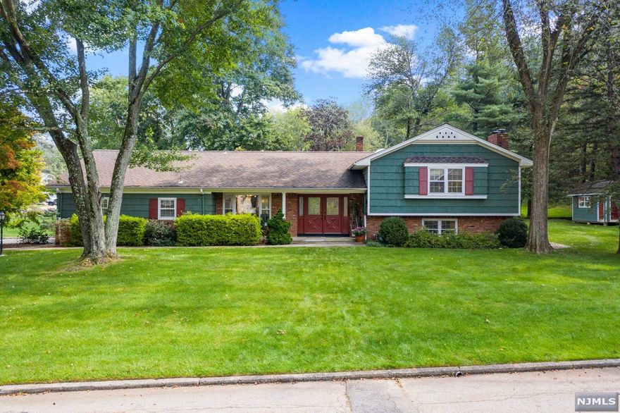 At the end of a quiet, dead end street lies this 3 bd/2.1 bath split level. Updated kitchen w/granite counter tops and SS appliances. Hardwood floors in formal dining room. Living room has hardwood floor under carpeting. Lower level has large family room with brick wall featuring a wood burning fireplace. Additional room which can be used as a den/office or workout space. Master bedroom with walk in closet and en suite. 2 additional bedrooms upstairs. Hall bathroom has been updated. Large 2 car garage with ample storage space.