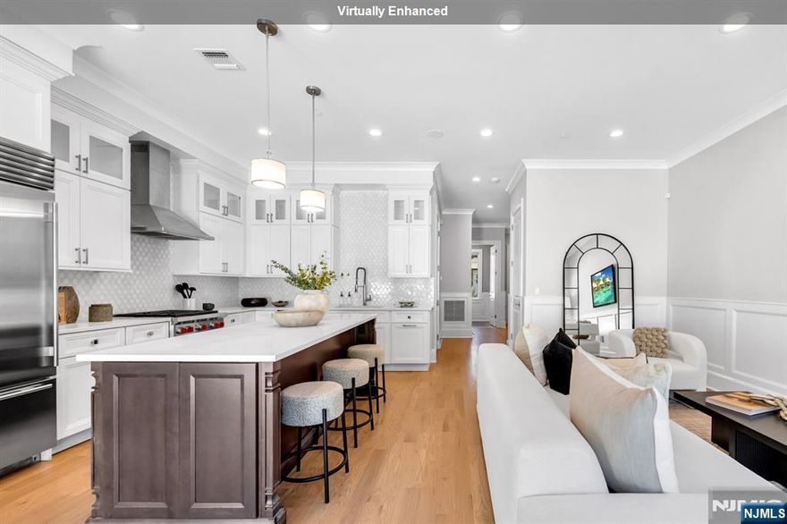 Stunning luxury townhome in Gabriel Estates, a boutique community in the heart of Paramus. Built just a few years ago, this residence has 3 bedrooms, 2 full baths, and 2 half baths, the home offers soaring 10-ft ceilings on the main level and 9-ft ceilings upstairs, creating a bright, airy ambiance. The gourmet kitchen showcases Sub-Zero and Wolf appliances, quartz countertops, and sliding glass doors that open to a private, fenced backyard. The impressive primary suite includes a massive walk-in closet and a spa-like bath with a Jacuzzi tub, oversized shower, and a double vanity. A fully finished lower level extends the living space with a spacious recreation room and a custom wet bar perfect for entertaining. Outdoor living is complete with a private patio and yard, all just minutes from the Garden State Parkway, Route 17, world-class shopping, and Paramusâ€™ top-rated schools.