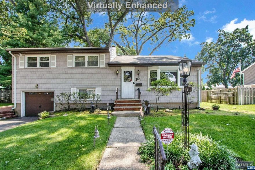 This very spacious Split Level w/immense Main Level Family Room addition & Home Office is located on the Haworth Border, on a beautiful street with lovely homes. Top Features include a Large Main Level Family Room Addition, An Eat in Kitchen with Large Skylight, a Main Level Home Office, & Central Air Conditioning. The Large Living Room w/Western Exposure opens to the Dining Room & wonderful spacious Family Room w/large windows facing East letting the natural light beam in, w/a side door leading to the spacious deck & rear yard. Main level home office & Powder Room! The Eat in Kitchen w/large skylight Opens to the Dining Rm. The Bedroom Level has 3 very spacious bedrooms & Full Bath. A ground level additional Family Room leads to the One Car Attached Garage & Laundry Room. This home has vinyl siding, a large deck overlooking the yard, and Central Air Conditioning. Located Close to house of worship and bus on nearby Schralenberg Road. Outstanding Value for this spacious home!