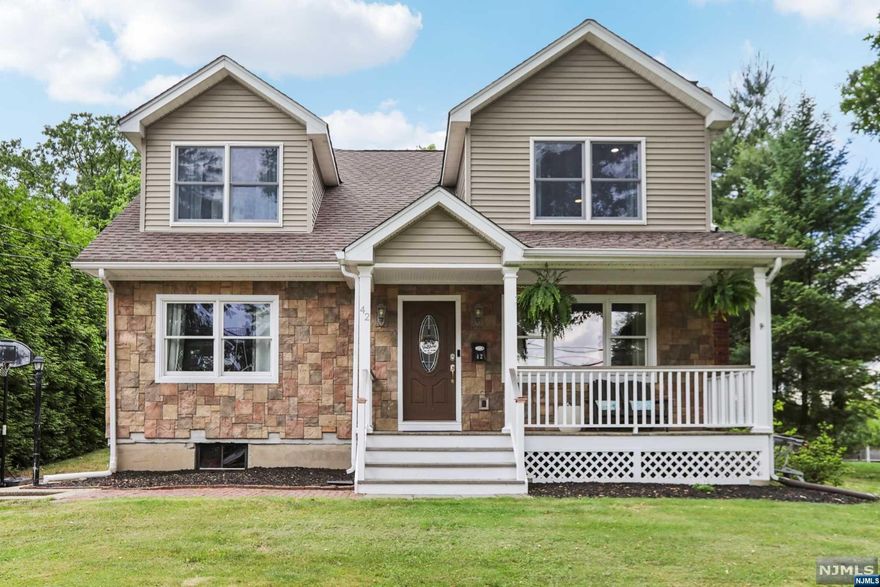 Quietly nestled in a sought-after neighborhood, this expanded and updated colonial home is sure to please. Situated privately on a .2875-acre lot, this 4-bedroom, 2.5-bathroom home is architecturally impressive. Features include 3 fireplaces, hardwood floors, crown molding, butler's pantry, recessed lighting, gathering room, owners' suite, full finished lower-level, patio and more. Masterful construction has created a home of superior details with a versatile floor plan accommodating gracious entertaining and comfortable family life. Park Ridge offers excellent schools, recreation, and shopping. Minutes to NYC transportation, schools and Houses of Worship. AMENITIES INCLUDE Hardwood floors Crown molding Recessed lighting 3 Fireplaces Ceiling medallions Updated electric Central Air conditioning High efficiency gas furnace, 3 zones Central vacuum system Open front porch Full finished lower level patio