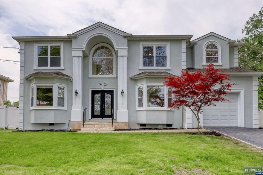 Stunning Spacious Colonial in one of the best neighborhoods, with bright and open layout. Impressive 2 story foyer, spectacular large modern kitchen with eat-in area and sliding glass door that seamlessly connects the interior to a large deck and a beautiful yard, Perfect for entertaining and enjoying outdoor dining experiences. The main level also offers a generously-sized dining room, living room, and family room where you can relax and unwind. A beautifully designed powder room adds a touch of elegance, while a large bonus pantry featuring a second stove provides additional space and versatility for your needs. The second floor features four massive bedrooms that will exceed your expectations. Each bedroom boasts impressive high vaulted ceilings and ample closet space. The oversized master suite is a true retreat, featuring a large bathroom and an amazing walk-in closet that will effortlessly accommodate your entire wardrobe. Finished basement with large rec room and bonus room