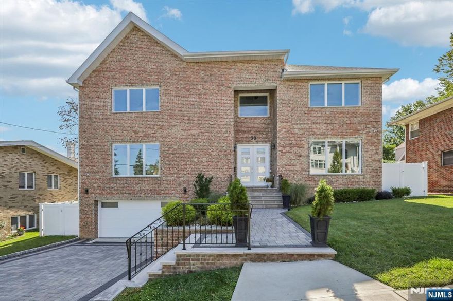 Be the first to live in this stunning brick single-family home offering over 4,500 sq. ft. of living space across four levels, designed for comfort, style, and functionality. Step into a grand foyer that opens to a sun-filled living room with a sleek fireplace and oversized windows. The chefâ€™s kitchen is the centerpiece, with quartz countertops, a massive island, custom cabinetry, and top-of-the-line stainless steel appliances, seamlessly connected to the dining area for entertaining. This home features five spacious bedrooms, including a luxurious primary suite with a spa-like bath and dual walk-in closets. Most bedrooms have their own full baths, with a total of five full baths and two half baths. The lower level includes a finished recreation space, a full bath, and access to the two-car garage â€” perfect for a home gym, media room, or playroom. The rooftop level is an entertainerâ€™s dream with a kitchenette, half bath, and deck showcasing partial NYC skyline views. Additional highlights include hardwood floors throughout, a dedicated laundry room, storage areas, and a paved backyard for gatherings. Located in desirable Cliffside Park, this home offers a quiet suburban feel with easy access to parks, schools, shops, and express transportation into Manhattan. Combining luxury finishes, a functional layout, and a prime location, this home is perfect for those seeking space and sophistication near the city.