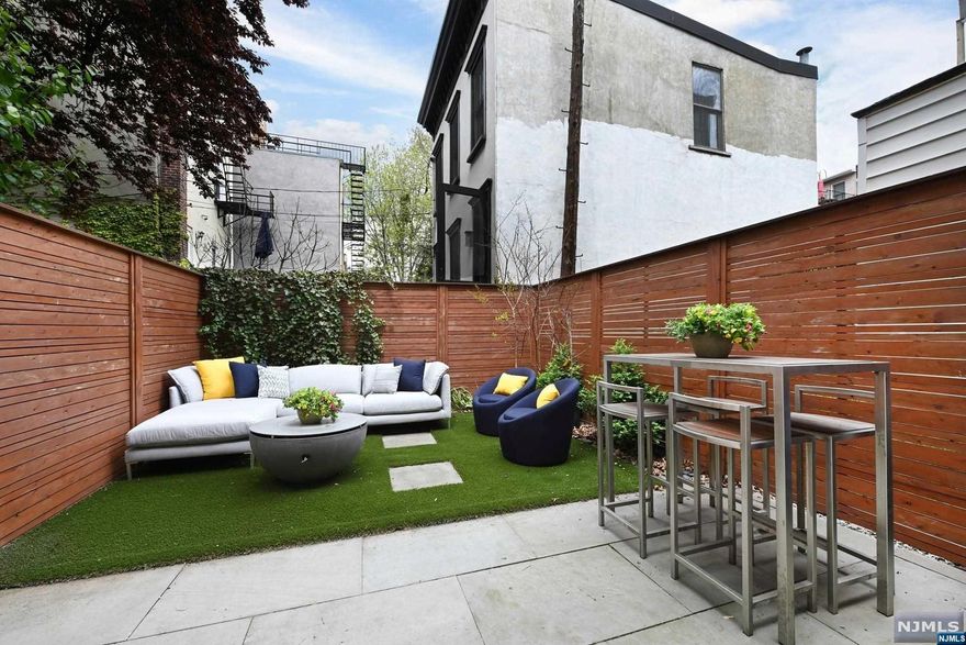 Welcome to this beautifully renovated single family home in an amazing location. Every detail has been thoughtfully designed and executed with impeccable taste, blending the charming appeal of exposed brick with modern updates. Enter through the Italian tile entryway and be struck by the open and inviting floor plan of the living room, dining room, and kitchen. The chef's kitchen features solid wood soft-closing cabinets, Caesarstone countertops and backsplash, Viking appliances, and countertop seating. The first floor also includes a half bath. Throughout the home, you can find Roman blackout curtains, Grohe fixtures, Franke sinks, and Robern vanities. On the second floor, you will find two bedrooms, a stylish bathroom with calcutta marble, full-size side-by-side washer and dryer, and storage. The third floor boasts a large primary suite complete with a walk-in closet and a beautiful bathroom. The lower level of the home offers a versatile space, including a small kitchen.