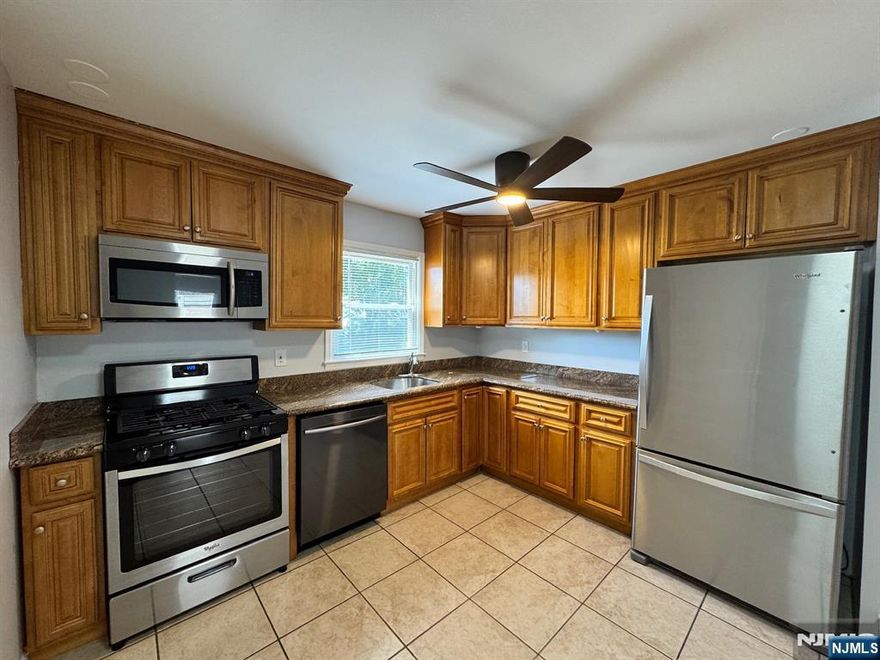 Welcome to this beautifully updated 1st-floor apartment located on a quiet cul-de-sac, offering space, comfort, and flexibility in a prime location. This 3-bedroom, 2-bath home lives like a 4-bedroom with a versatile bonus room perfect for a home office, gym, or nursery. The updated kitchen features granite countertops, stainless steel appliances, and a dishwasher, opening to a large formal dining room and spacious living areaâ€”ideal for entertaining. The primary bedroom includes French doors leading to a private en suite bathroom and sliding glass doors to your own private deck. Additional highlights include a 1-car attached garage, a second driveway parking space, laundry room, ample storage, and ceiling fans throughout. Each bedroom has its own independent A/C unit for personalized comfort. Nestled in a highly rated school district, this home is just a short walk to downtown shops and restaurants, with the scenic Saddle River County Park trail right in the woods behind the property. Plus, Plauderville Train Station is less than 10 minutes away, offering a convenient commute to NYC. This home truly combines style, space, and location. Won't last for long, donâ€™t miss out! TENANT VACATED 9/15/25. NOW VACANT. VERY EASY TO SHOW ANY TIME. Owner holds NJ RE Lic