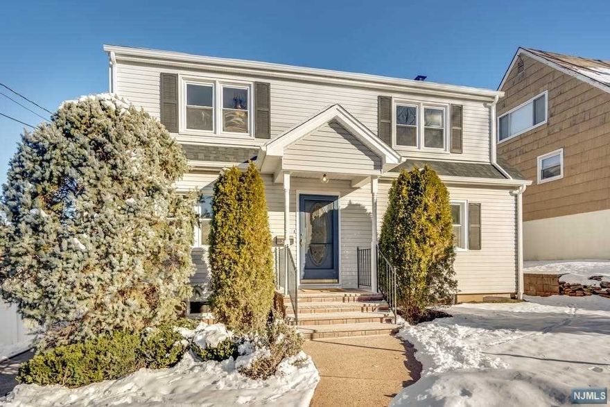 Welcome to this beautifully renovated & expanded 5 bedrm, 3 full bathrm colonial on a desirable street! Upon entering you will be welcomed by sought-after open concept floor plan! Sun-filled liv rm w/ coat closet opens to gourmet kitchen w/ quartz countertops, SS appls & hw floors, separate breakfast area w/ sliders overlooking deck & lush backyard plus adjacent din rm. A full bath & 2 bedrms complete 1st level. The 2nd level features a luxurious master bedrm suite w/ walk in closet & 2 add'l closets, stunning master bathrm w/ marble tiles, double vanity, large stand up shower & separate linen closet. Two add'l spacious bedrms, full bathrm & laundry rm complete 2nd level. The basement is full w/ convenient access to outside. Other features incl new central ac on 2nd level, 2 zone heating & cooling, new elec 200 amp svc, new roof, recessed lights, most new windows, hw flrs throughout & so much more! Easy commute to NYC, bus & downtown shops & restaurants. Agent related to Owner.