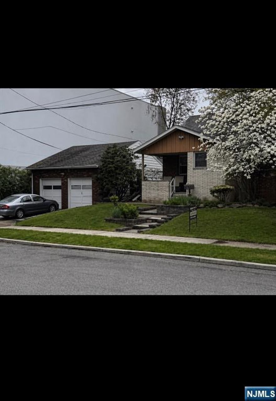 Charming home with wonderful potential situated on approx. 100 X 100 Lot, at the end of a dead end street. Seller owns 1/2 of the street approximately 30' feet long for additional parking and accessing a two car garage. The second floor is open and can be easily expanded for bedrooms and bath
