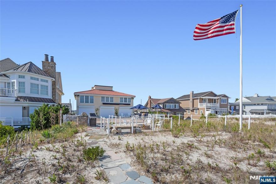A beautiful Spanish-style oceanfront home sits gracefully on a pristine white-sand beach, offering a perfect blend of traditional elegance and coastal luxury with breathtaking sunrises and a sparkling ocean,large 40ft deck is ideal for meals while enjoying the ocean breeze,fire pit area, natural gas grilling station,3200 sqft property offers 6 bedrm, 3.1 baths, elevator,Entering into the living room overlooking the deck step down to a large dining rm with woodburning fireplace,open concept kitchen perfect for entertaining,1 lg bedrm,full bath and laundry/utility room,the top floor offer an Ocean View Master w/dressing area/office and full bath w/jetted tub,5 other generous bedrooms,full bath,Take the elevator to the lower level with a 2 Car Garage w/storage room,Transform the back storage room into a family room leads out to an open area under the deck for for those rainy days, enjoy walks on the beautiful beach or just soaking in the Sun,Close All The Jersey Shore offers all year long