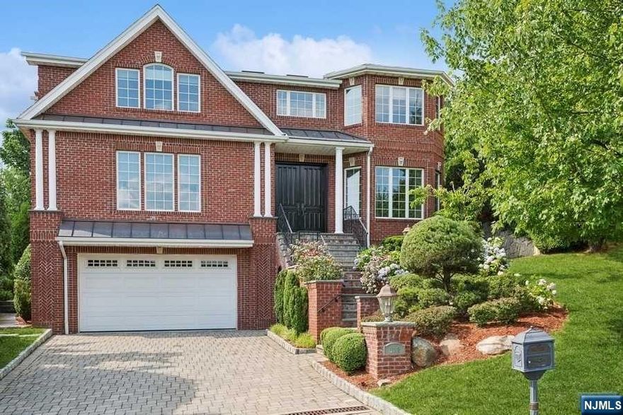 Welcome to this meticulously maintained all-brick center hall colonial, exquisite craftsmanship and timeless elegance. Located in sought-after Englewood Cliffs, this home boasts soaring ceilings and detailed molding throughout. Entering the welcoming two-story foyer, you're seamlessly guided to the living rm, dining rm, family rm, and a first-floor bedroom suite. The heart of the home is the gourmet kitchen, with Viking appliances and a breakfast area overlooking the serene backyard. Ascending to the 2nd floor, find a sanctuary of comfort and luxury. The expansive primary suite offers a luxurious bath, walk-in closet and Fire pl. A junior suite and two additional bedrooms, alongside a full bath and Laundry rm. The fully finished basement provides extra living space with a bedroom suite and recreational rm w/Wet bar. The grounds feature a stone patio w/built in Bbq and full house generator. Minutes from NYC, offers low tax. Welcome home to unparalleled comfort and sophistication.