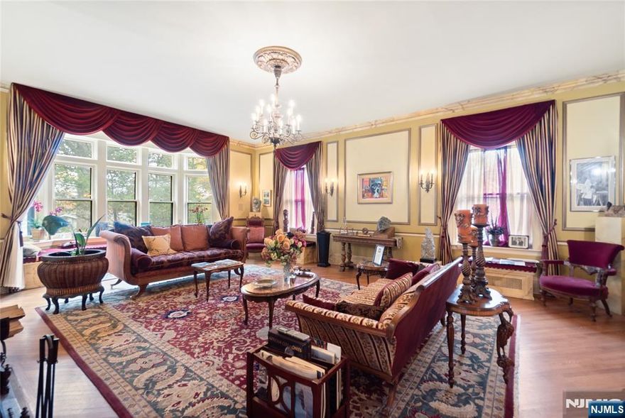 Step into a storybook! nestled in the heart of the prestigious Gregory Avenue enclave, this majestic Tudor manor stands as a timeless celebration of history, craftsmanship, and refined luxury. Built in 1873, this estate spans more than 5,600 sq ft of beautifully preserved architecture from its slate roof and stucco-clad facade to its original woodwork & graceful stairway. Upon arrival the sweeping circular driveway & lush landscaping invite you into a serene, private wonderland complete with a tranquil koi pond, stream & stone patio where nature whispers. Inside, the grand foyer welcomes you with a soaring staircase framed by elegant moldings, leading into a formal living room, parlor, and dining room. The gourmet kitchen is a chef's dream gleaming oak floors, top-of-the-line Viking ranges, dual dishwashers, a Sub-Zero fridge, & butler's pantry. Entertain like royalty across multiple gathering rooms, or slip away to the solarium, where sunlight pours in & glass doors open to the outdoor oasis. Upstairs, the ten bedrooms offer ample space perfect for guest. Rooms ft charming architectural Details, original hardwoods, & historic charm at every turn. Outside, the estate unfolds into park-like grounds nearly an acre of secluded beauty, complete with mature trees & stone pathways. Whether you envision garden parties, morning coffee, or evening reflection this landscape offers a rare escape. This estate is part of the Upper Gregory historic district.