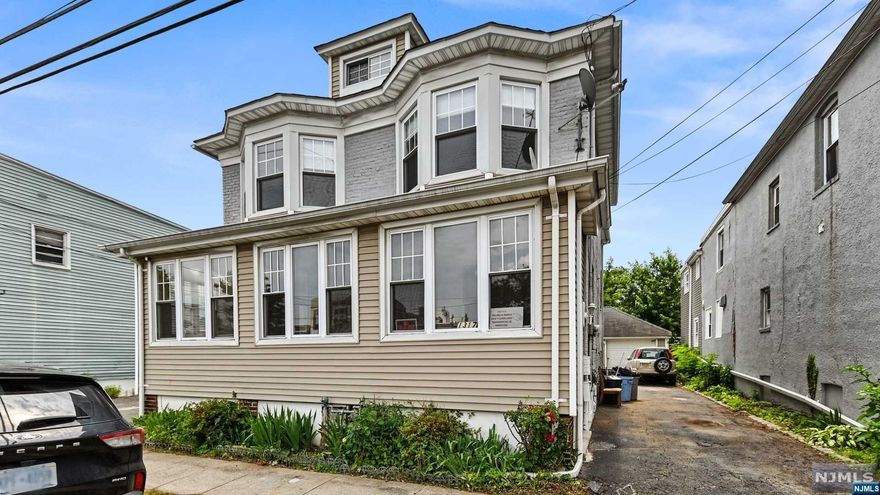 Great 2 Family to Live in & Collect Rent or Strictly Investment Opportunity! 2 Family Home Features 2 car Garage, Private Driveway and Separate Utilities. Each unit offers 2 Bedrooms and Full Bath, Living Room and Kitchen. 1st Floor unit also includes Dining Rm, Enclosed Porch and Laminate Floors. Don't miss the nice-sized backyard and full basement with storage! Located Closely to Schools, Shopping, Highways and NJ/NY Transit Transportation.