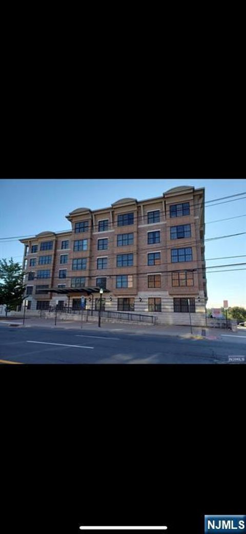 Photo of 54 Polifly Rd #506, Hackensack, NJ 07601 (MLS # 26003763)