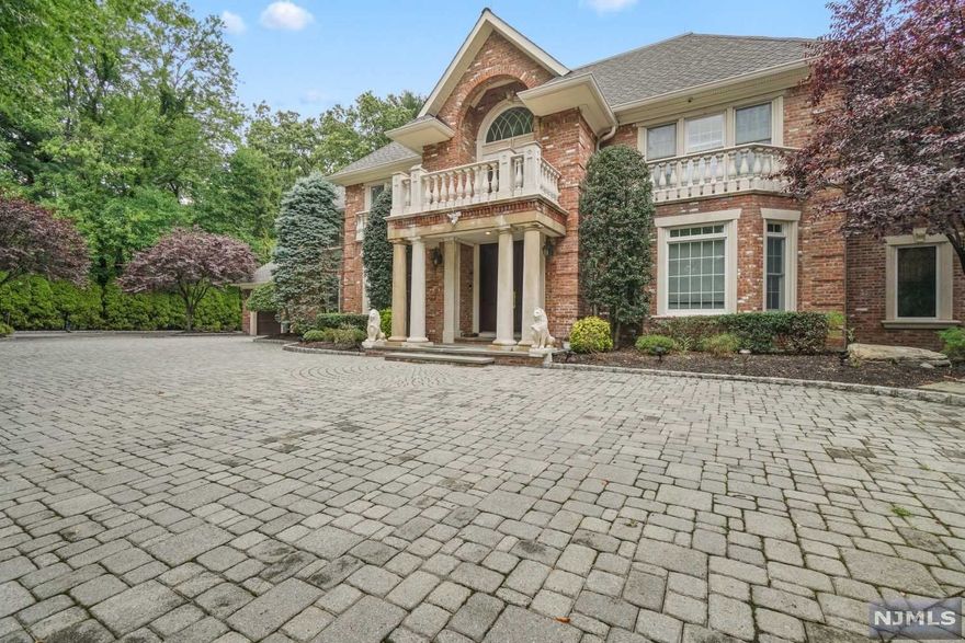 The most spectacular house you were waiting for nestled in a very private setting sitting on half an acre with an oasis of a backyard and around 10,000 square feet. Custom Built colonial seamlessly blends traditional and modern with 5 bedrooms nestled on a park-like professionally landscaped setting in the highly sought after city of Paramus. The first floor features hard wood floors throughout its multiple gathering areas designed for hosting large parties along with intimate gatherings. The EIK features high end appliances and a huge breakfast nook. In addition to the expansive en-suite master bathroom retreat, this home also features 4 additional full baths and 2 updated half-baths. The centerpiece of the rarely found private backyard features an in ground pool with a jacuzzi and waterfall. The finished walk out basement with outdoor covered porch and huge movie room is an entertainers dream. Low Taxes and close proximity to the city is a great plus with Blue ribbon schools.