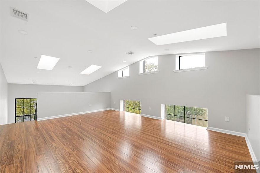 This unique multi-floor 1-bedroom, 1-bath condo is nestled in the desirable Hillcrest section of Paterson, NJ. Featuring dramatic double-story ceilings in both the living room and bedroom, the home offers an open, airy feel with abundant natural light. Enjoy the convenience of in-unit laundry, central air and heat, and one assigned parking space. The spacious layout includes a bright living area, full bathroom, and a loft-style bedroom with great privacy. Located in a quiet residential neighborhood close to parks, schools, public transportation, and major highways, this condo blends comfort and style perfect for first-time buyers or savvy investors.