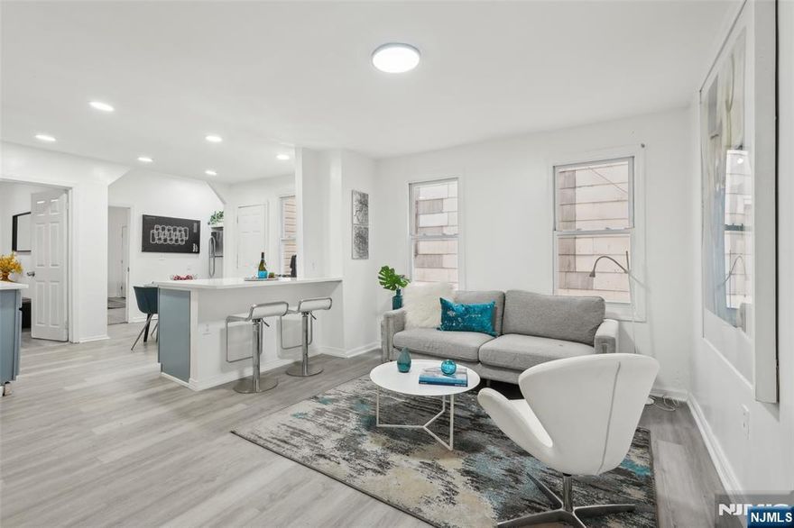 Discover a great investment opportunity with this well-maintained two-family home offering 5 bedrooms and 2 bathrooms. The first-floor unit features 3 bedrooms, a spacious living room, a newly updated eat-in kitchen with granite countertops, and a renovated full bath. The second-floor unit includes 2 bedrooms, a bright living room, modern kitchen, and updated bathroomâ€”move-in ready. Enjoy a large newly fenced backyard, ideal for outdoor use. Additional features include an unfinished basement with private entrance, attic for storage, and 2 gated parking spaces. Recent upgrades: new stairs, water heaters, and roof. Conveniently located near public transit, shopping, and dining. Just 15 minutes to Newark Airport and Penn Stationâ€”perfect for commuters. With comfortable living spaces, low taxes, and a strategic location, this property is an excellent choice for investors or owner-occupants.