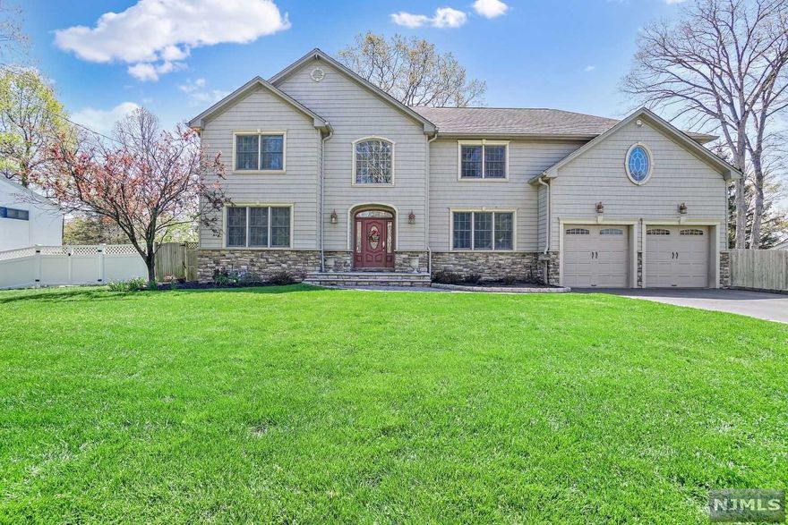 Gorgeous 4-5 BR Center Hall Colonial. Updated & Move in Ready. Home is set deep in a beautiful tree lined residential neighborhood within approx 1 mile to Excellent K-12 Schools & NYC bus stop. Built in 2006. Higher end appliances throughout. Upstairs all very spacious BR's W/WALK IN CLOSETS. 2nd family rm upstairs can be turned into a second large master BR (for 4 BR up). 2nd fl Laundry. Two beautiful, updated baths on 2nd floor. Main flr office possible 5th bedroom since garage has an office. First fl: Fam rm w/stone fireplace, gorgeous formal DR, Office/BR, Huge High end chefs Eat in Kitchen W/oversized granite island with warming drawer,sliders to composite deck, Powder rm, walk in pantry, office in oversized garage. Full unfinished basement with Superior concrete walls. Central Air, 200 Amp, Central vac, sprinklered, whole house pre filter, radiant heat under all tiled areas, 2 zone A/C, 8 zone heat. See Floorplans. Seller is a licensed realtor.Highest & Best by 5/31 noon