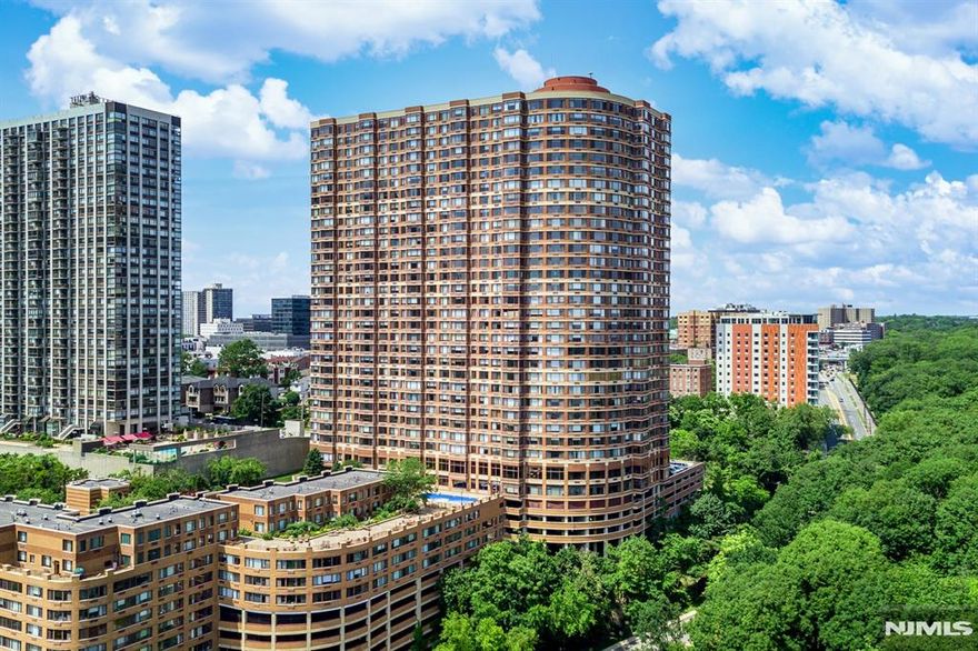 This south-facing residence offers breathtaking panoramic Hudson River views and is filled with abundant natural light throughout the day, creating a bright and inviting living space. The unit features hardwood floors throughout, in-unit washer and dryer, and indoor parking for added convenience. Enjoy a luxury, community with exceptional amenities including a 24-hour doorman, state-of-the-art fitness center, outdoor pool with BBQ area, childrenâ€™s playroom, library, valet parking, dry cleaning service, deli, and on-site management. Ideally located with an easy commute to NYC and quick access to major highways. Situated in a highly regarded school district and close to schools, shopping, parks, and New York transportation, offering both convenience and an exceptional lifestyle.