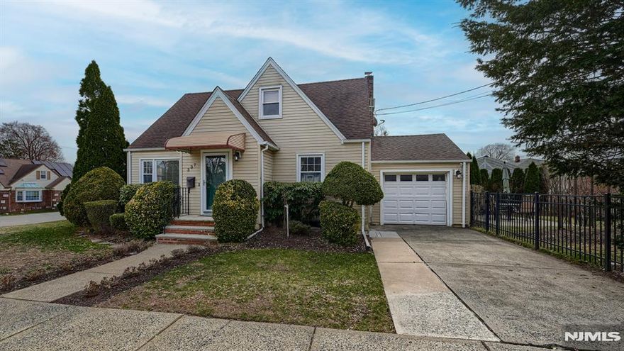 A true gem awaits at 337 Madison Ave in Clifton! This charming and meticulously maintained Cape offers fabulous curb appeal and a warm, inviting feel from the moment you arrive. The flexible floor plan features 2 bedrooms with the potential for a 3rd and 2 full baths. The main level welcomes you with a bright living room flowing into a dining room with elegant French doors, which can easily serve as a third bedroom if desired. A beautifully renovated modern full bath, comfortable main-floor bedroom, and eat-in kitchen with access to a charming covered side porch complete this level perfect for morning coffee or relaxing evenings. Upstairs boasts a spacious primary bedroom suite with a full bath, abundant closet space, and walk-in attic storage. The finished tiled basement expands the living space with a large recreation room, office area, laundry room, storage, and Bilco doors providing direct access to the yard. Outside, enjoy a meticulously landscaped, fully fenced yard with a paver patio, ideal for outdoor dining and entertaining. Additional highlights include hardwood floors on the main level, updated windows, newer furnace and central air (2022), hot water heater (2019), roof (2012), a 1-car garage, and private driveway. Conveniently located near NYC transit, major highways, shopping, and parks. Don't miss your chance to call this Clifton charmer home!