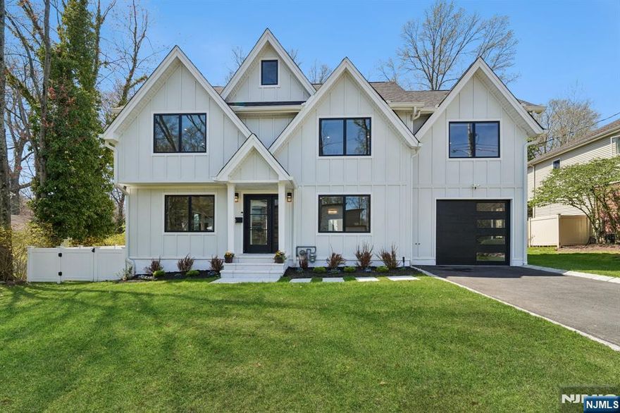 Completely renovated and expanded, this stunning 6-bedroom, 5.5-bath modern colonial is set on a quiet street on the East Hill of Demarest. Designed with a contemporary flair and an open floor plan, the main living spaces flow seamlessly from the living room and dining room to the family room and gourmet kitchen, featuring imported cabinetry and top-of-the-line appliances. The first floor also offers a bedroom suite, guest powder room, and mudroom that exits to the tandem 2-car garage. Upstairs, the luxurious primary suite is complemented by two additional bedroom suites, an additional bedroom, full bath, and laundry room. The fully finished basement adds exceptional living space with a large recreation room, gym, bedroom, and full bath. Outside, enjoy a new patio and completely fenced heated pool, creating the perfect setting for relaxation and entertaining. Conveniently located near top-rated Blue Ribbon schools, this exceptional home offers the perfect blend of style, comfort, and location.