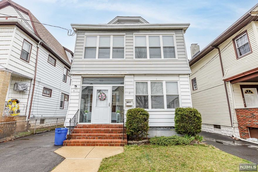 Your next best investment awaits! 2 Family home is bursting with income potential. 2 Units each with 2 Beds, 1 Bath, Living Room, formal Dining Room and an EIK. Carpet throughout. All separate utilities. The full finished attic has a full bath and kitchenette which is ideal for even more revenue. Full basement has storage and laundry hook-up. Plenty of driveway parking. Detached garage and backyard, too! Spruce it up with some modern charm to really increase the value. You're guaranteed to make money on this home. Come and see today!