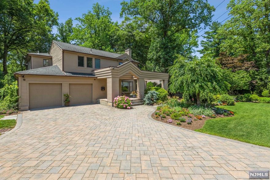 NEW TO THE MARKET!! PICTURE PERFECT!! OPEN FLOOR PLAN!! SET ON TENAFLY'S PRESTIOUS EAST HILL, THIS HOME HAS BEEN COMPLETELY UPDATED AND READY TO MOVE IN!! UNIQUELY DESIGNED 5B/R,5.5 CONTEMPORARY HOME THOUGHTFULLY RENOVATED TO BE PERFECT FOR A FAMILY.FIRST LEVEL FEATURES A DEN,FPL,POWDER ROOM,CHEF'S KITCHEN,ENSUITE B/R,LNDRY,HUGE L/R,D/R WITH SOARING CEILINGS,OVERHEAD WINDOWS PROVIDING NATURAL LIGHT,SLD DOOR OUT TO CUSTOM DESIGNED DECK OVER LOOKING PARKLIKE PROPERTY.SECOND LEVEL FEATURES PRIMARY B/R SUITE,NEW MARBLE BATH/WHIRLPOOL & SAUNA,3 ADDITIONAL BEDROOMS WITH 2 NEW BATHS. THE LOWER LEVEL IS FULLY FINISHED WITH HOME THEATER,REC. ROOM, FULL BATH & OFFICE/ BEDROOM. PROFESSIONALLY LANDSCAPED WITH OVERSIZED DECK AND STONE PATIO. THIS HOME IS COMPLETE WITH ALL AMENITIES INCLUDING ETHERNET WIRED, NEST THERMOSTAT, SECURITY SYSTEM & PROPANE GENERATOR. THIS RESIDENCE IS CONVENIENTLY LOCATED TO SCHOOLS & HOUSES OF WORSHIP.