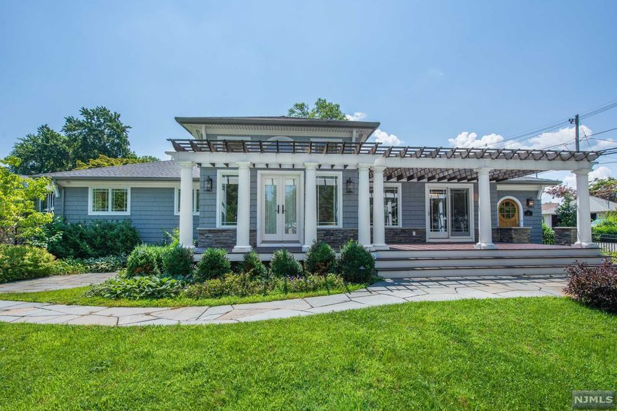 Beautiful, Sprawling, Updated Ranch in the desirable Indian Lake community! Step into this secret garden through a wooden arch and gorgeous gates. Fabulous Open Living Space. Living room with tray ceilings and stone faced gas fireplace.. Bright, Sunny Eat-In-Kitchen w/Granite Counters & High End SS Appliances. French doors to enjoy the qide composite deck with pergola. Large, Welcoming Foyer w/Unique Arched Wooden Door! Gorgeous hardwood flooring & solid custom wood doors and crystal door knobs throughout. 3 generous sized bedrooms equipped with lots of closet space. Grand Primary suite showcases high ceilings, automatic blinds, custom walk-in closet & bath w/oversized spa shower. Main bath features gorgeous tile work & jetted tub. Flexible Finished Room in Basement. Family room, wet bar, laundry & 3rd full bath. 2 Car Garage & TONS of storage! Stunning landscaping and so many extras completed w/quality craftsmanship. Stones throw from ILCC diving board beach & Bistro.