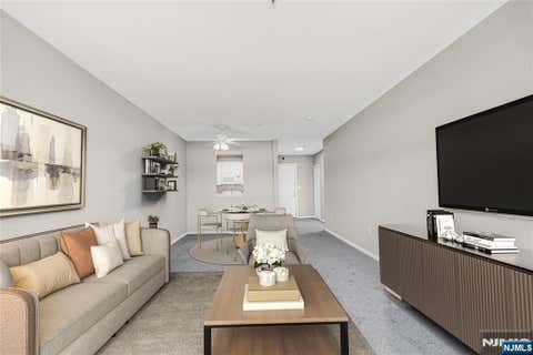 Photo of 905 River Rd #312, Edgewater, NJ 07020 (MLS # 25040402)