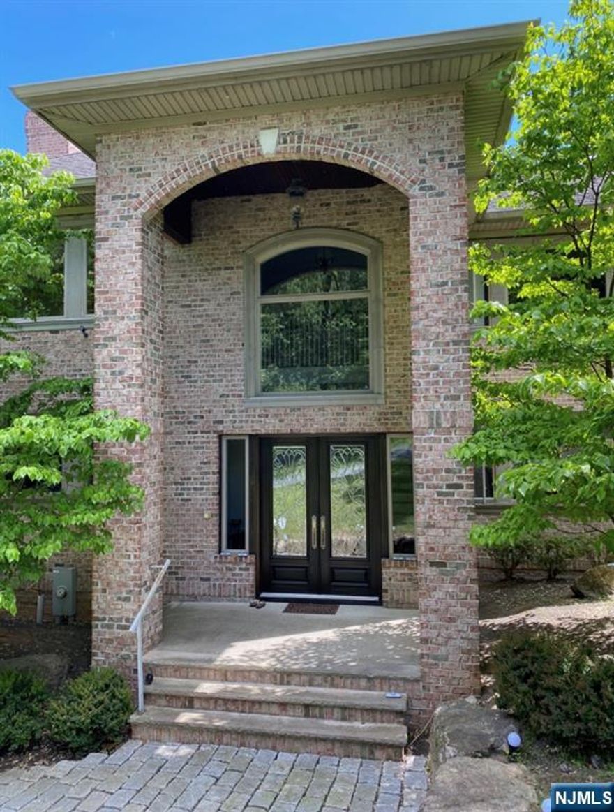 Stunning from the curb & remarkable within, this 5 Bed 4.5 Bath solid Brick Colonial is an estate for the discerning. Tucked away on a private road perfectly appointed on a sub dividable lot on a compound-like setting with gated entry offering unmatched privacy. Offering 6350 sq ft of finished living, along with a finished walk-out ground level offering an extra 2200 sq ft of new construction, its the perfect forever home, Inviting foyer welcomes you in to find a thoughtfully designed interior with generous room sizes, HW flrs, and plenty of natural light all through. The main level holds a living room, dining room, office, laundry room, 1/2 bath & family room with gas fireplace that opens to the gourmet eat-in-kitchen. EIK offers top-of-the-line, designer appliances, a large center island that is ideal for gathering, gorgeous granite and marble countertops & more. Head upstairs to find all 5 generous bedrooms with the beautifully upgraded full baths, inc the luxurious Master Suite. MBR boasts its own walk-in closet, fireplace & full ensuite bath. Princess Suite with its own full bath is an added bonus. True finished walk-out lower level offers an additional 2200 sq ft of multi-use living space, ideal for entertaining, multi-gen living &more. 3 car garage offers plenty of parking & storage. Live in luxury & total privacy, just minutes away from major highways for a seamless commute, NY/NJ public transportation to NYC, shopping, dining, parks and more. A turn-key MUST SEE!