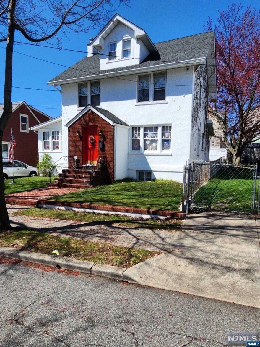 Welcome to this colonial with LOW Carlstadt taxes. This home has enough space to be a starter home and grow your family in it. This home features beautiful original wood work and hardwood floors thru out. The 1st floor has LR with gas fireplace, DR, Sun Room, Large EIK and a powder room. 2nd fl has 3 bedrooms and a full bath. The attic is finished and also has a separate storage room. The basement is semi-finished with laundry, utilities and a few different storage rooms. Driveway will fit 3-4 cars. Detached garage and house sold "as is". ** Abandoned oil tank is being removed by sellers**