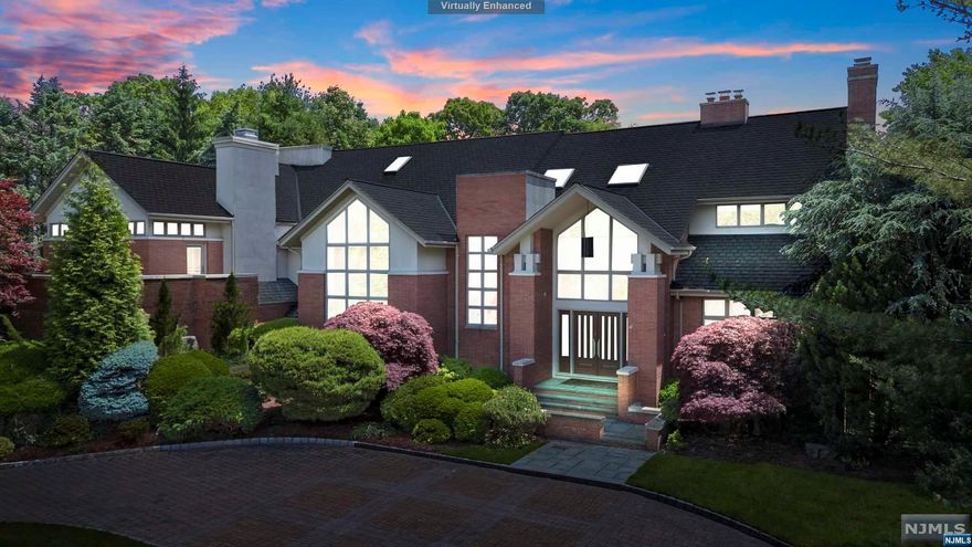 Step into luxury living at its finest with this breathtaking estate nestled on an elevated and highly sought location in East Hill Cresskill. This expansive and architectural masterpiece boasts 6 bedrooms and 6.5 bathrooms with high ceilings and natural light from every level. From the grand foyer to the gourmet kitchen with state of the art newer appliances, expansive great room surrounded by floor to ceiling windows, family room and library, no detail has been overlooked. The stunning backyard features a free form newly resurfaced gunite pool with custom rock formation wall and lush landscaping. Enjoy panoramic western views of the sunset from the private terrace in the lavish mezzanine level master bedroom suite with a fireplace and private stone patio, large closets and huge spa-like bathroom. Convenient access to NYC with top rated schools in Bergen County... not to be missed!