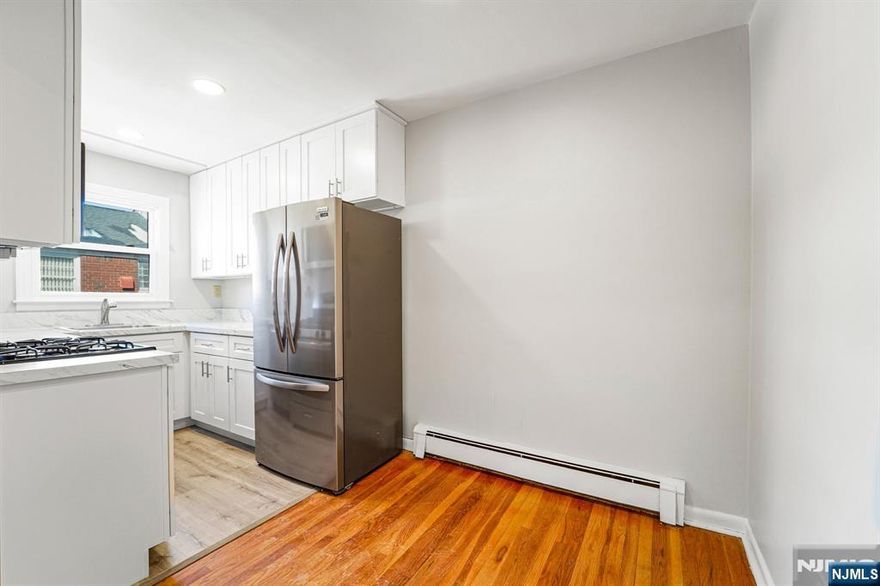 Spacious top-floor unit with no one above you, featuring hardwood floors throughout and a brand new white kitchen with stainless steel appliances. The apartment offers a separate dining area and a large living room, along with abundant storage including two bedroom closets, a pantry, coat closet, and linen closet. Assigned parking is available and convenient on-site laundry is provided. Ideally located near major highways and public transportation, with close proximity to On3, Hackensack Meridian Medical School, Seton Hall University, and Montclair State University. Docuverus tenant application required. Unit B5