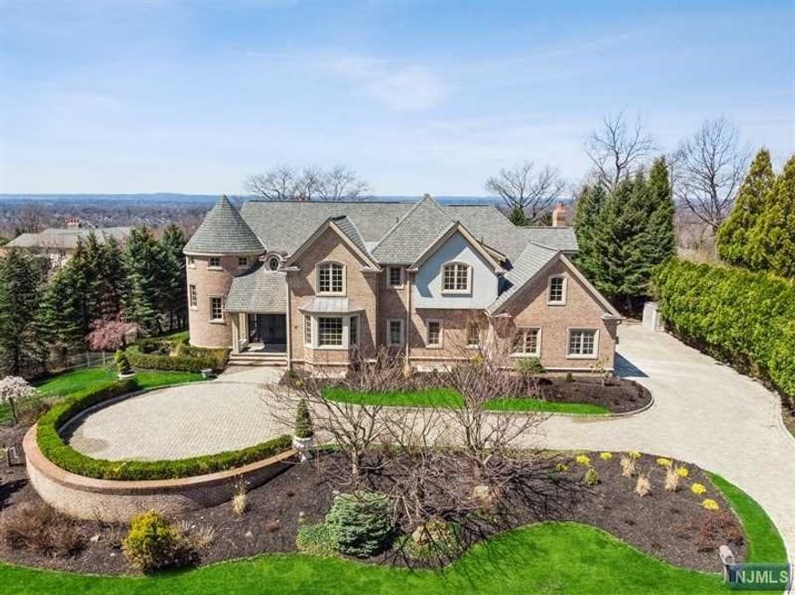 Welcome to an East Hill dream! This spectacular 6 BR, 6.5 bath Cresskill Colonial offers stunning details throughout. Enter through grand, circular driveway past exquisite landscaping & walk into stunning natural light that beams off of gorgeous & new Du Chateau hardwood floors that extend throughout the home. Main level boasts living room w/fireplace, formal dining room, Italian, MEIK w/new Wolf & Subzero appliances & center island w/easy access to lush, private backyard property. 2nd floor offers a true master suite w/fireplace, sitting area, spa-like master bath & dream-worthy walk-in closet. Additional bedrooms share same great closets & laundry room & bathrooms are renovated. Basement is fully finished w/theatre room w/160" screen & ATMOS professional audio system, REC room, at-home gym, 2nd laundry room. Home has Sonos system, Lutron lighting, Ring cameras, central alarm, HVAC, 5 zone AC/heat, & generator. Heated Gunite pool to be built. Absolute perfection in every sense!